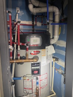 Water heater closet piping with mixing/recirc
